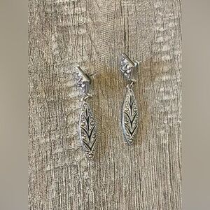 Vintage metal and gray rhinestone diamond and oval shape dangle costume earrings